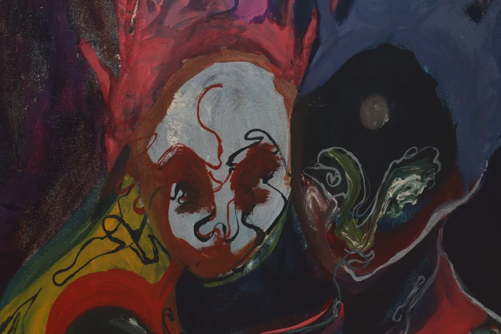 Two abstract faces, one pale and one dark, appear side by side in bold red, blue, and black brushstrokes.